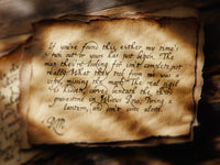 Vintage parchment with handwritten text and warm, amber light cast from a nearby window