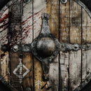 a digital illustration of an old medieval shield, cracked and battle-scarred it is covered with letters from the elder tongue font