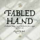 Cover image of the Fabled Hand font, featuring the font name in a stylized, gothic-inspired hand-written style, with a backdrop suggesting a fantasy or magical theme.
