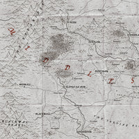 An old map of a fictional fantasy kingdom, drawn on crumbled paper with black ink