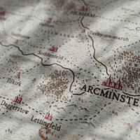 A view of a fantasy map with very shallow depth of field, illustrating the settlement brushes by Aesoterik