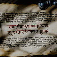 An old scroll is covered with bizarre writing that appears to be that of an intelligent but non-human race 