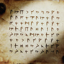 An archaic sheet of paper is covered writing that looks ragged and scrawled and not entirely human