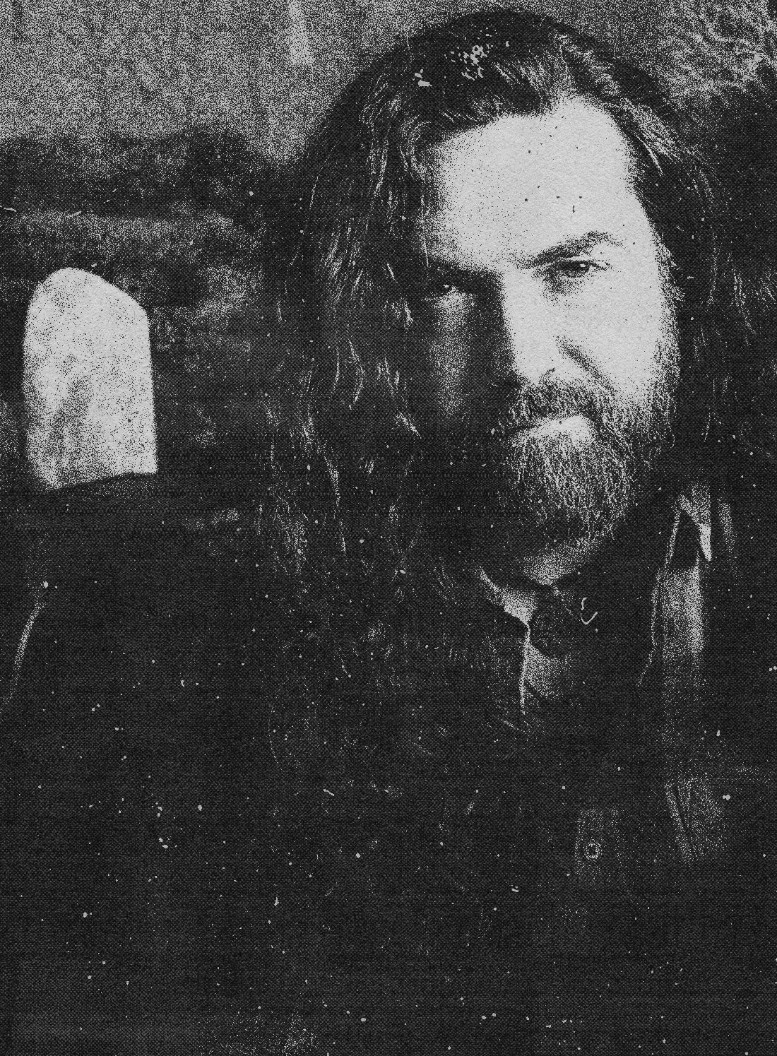 Grainy OSR zine inspired photograph of Rian Magee, bearded and long haired owner and lead creative at Aesoterik