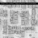 A black and white digitally created fantasy map of a town with label icons used to quickly describe the building and trade types 